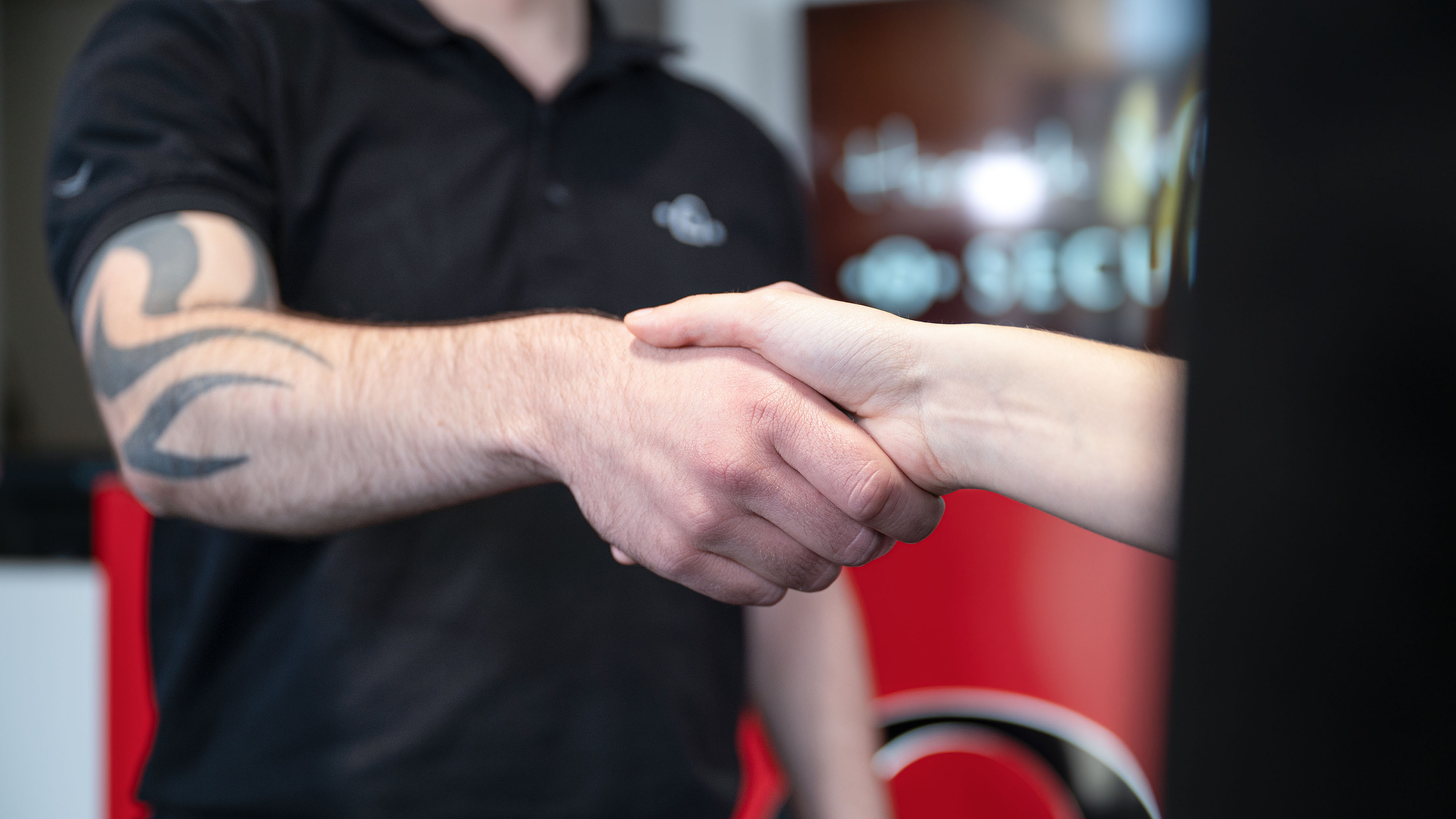 Together with our partners we are strong. Two people shake hands.