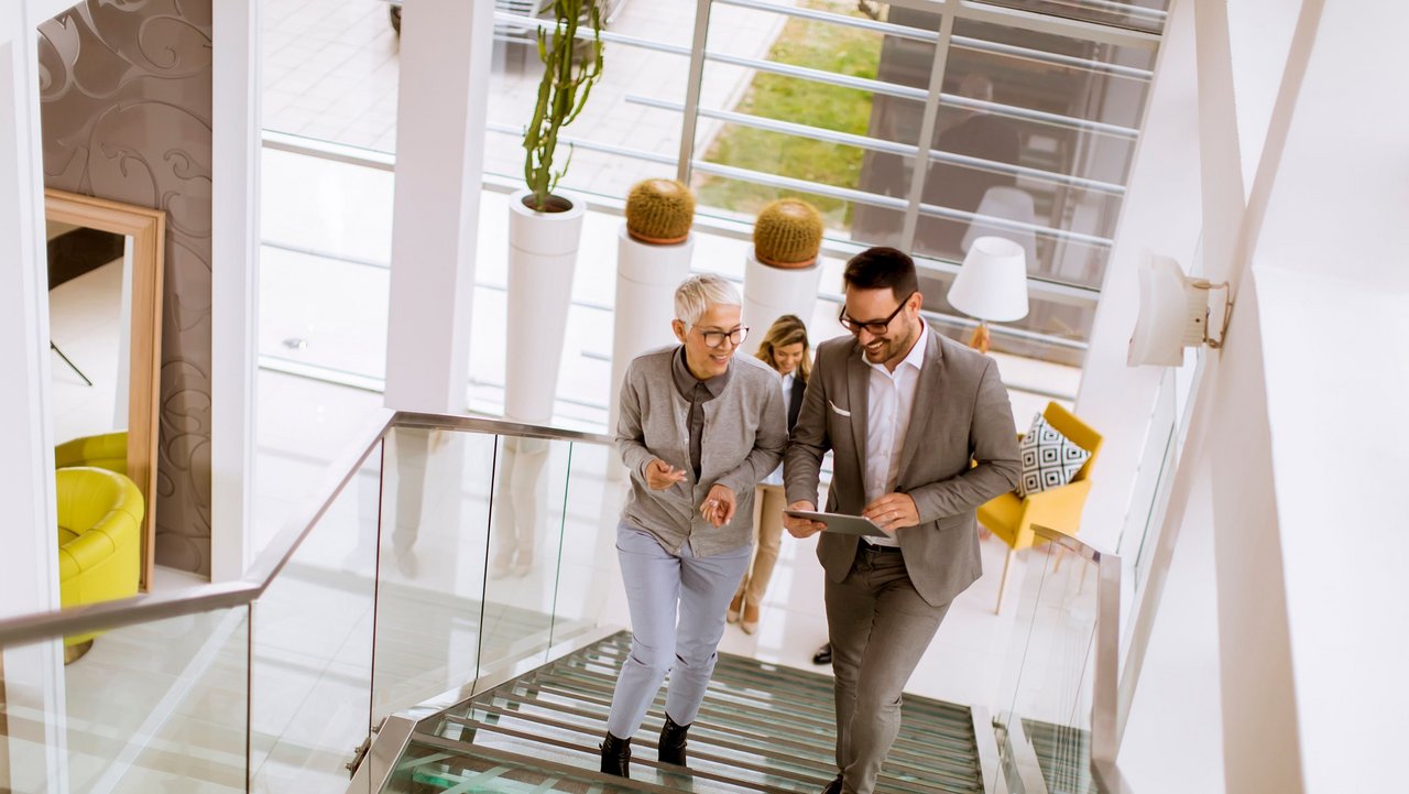 Man walks up the stairs with a customer