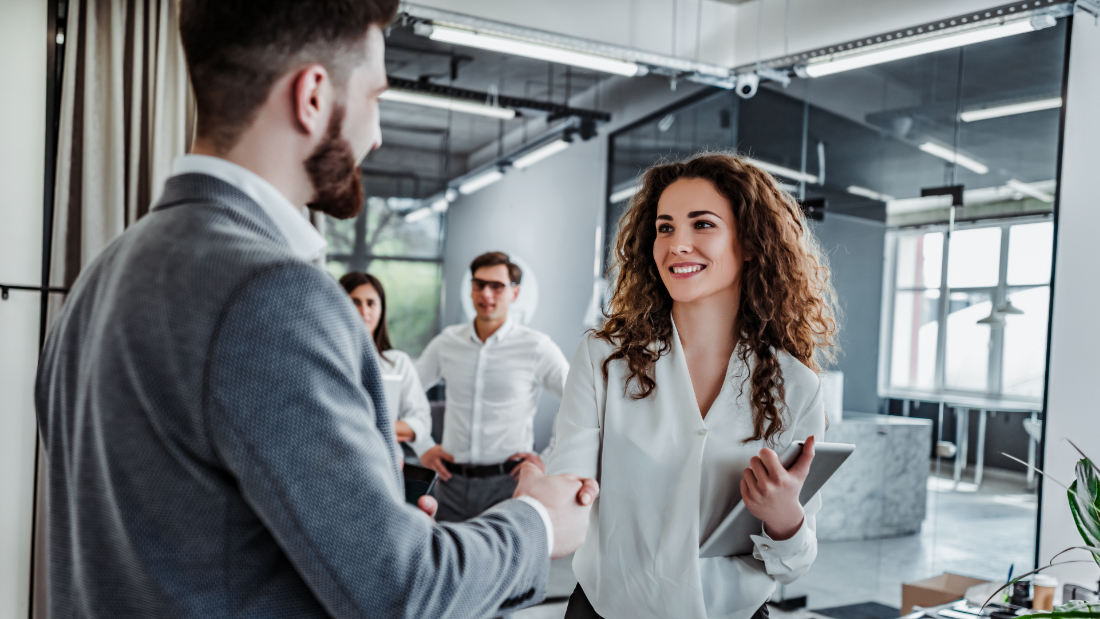 With Securepoint the right partner for IT security Woman greets costomer