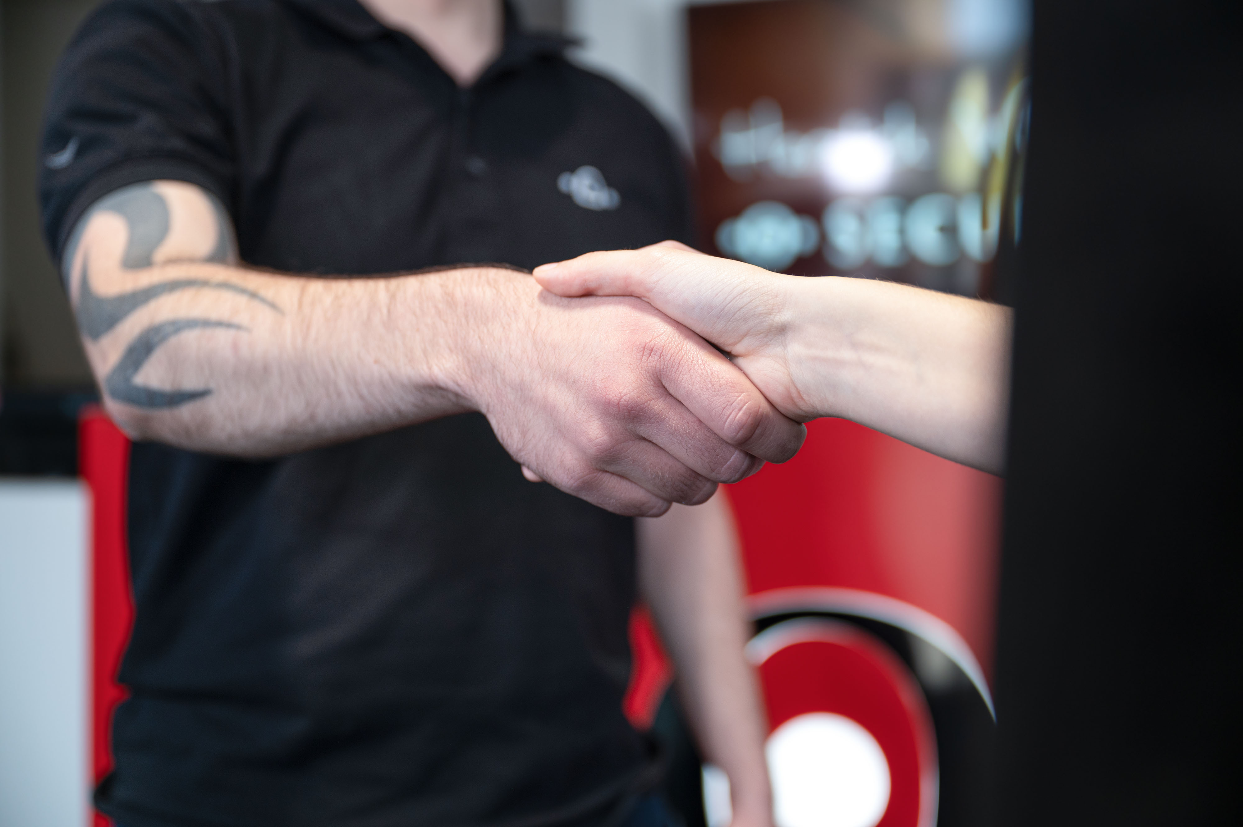 Together with our partners we are strong. Two people shake hands.