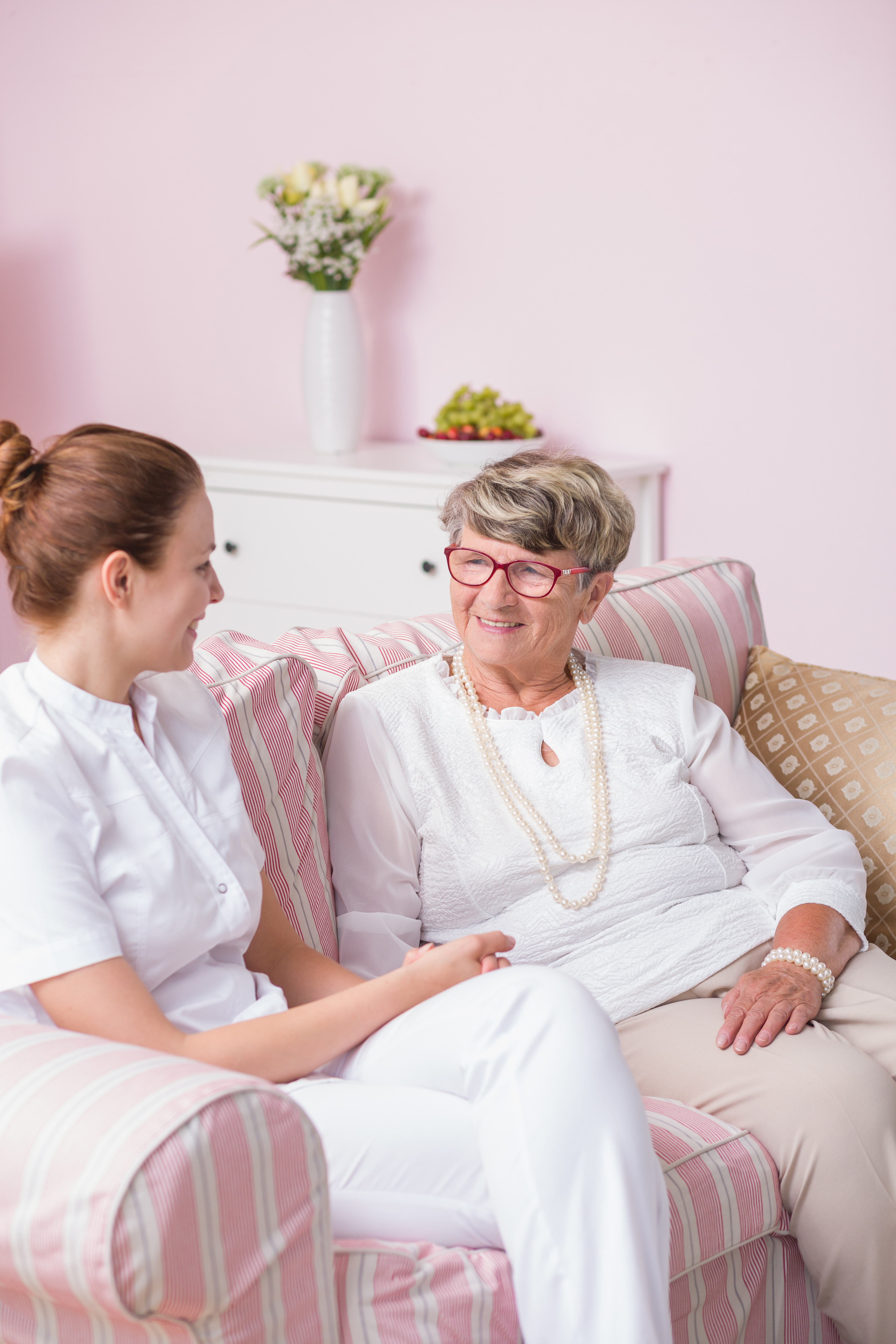 IT security for nursing Nurse converses with senior citizen
